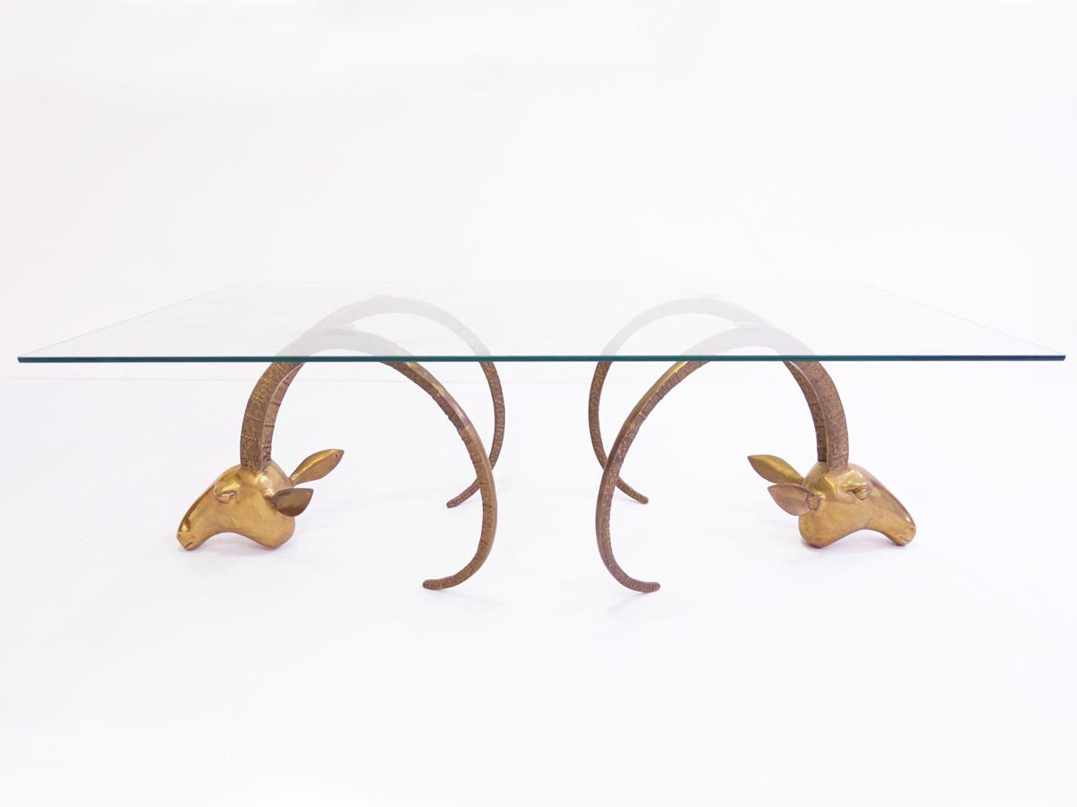 Sculptural brass ibex heads coffee table