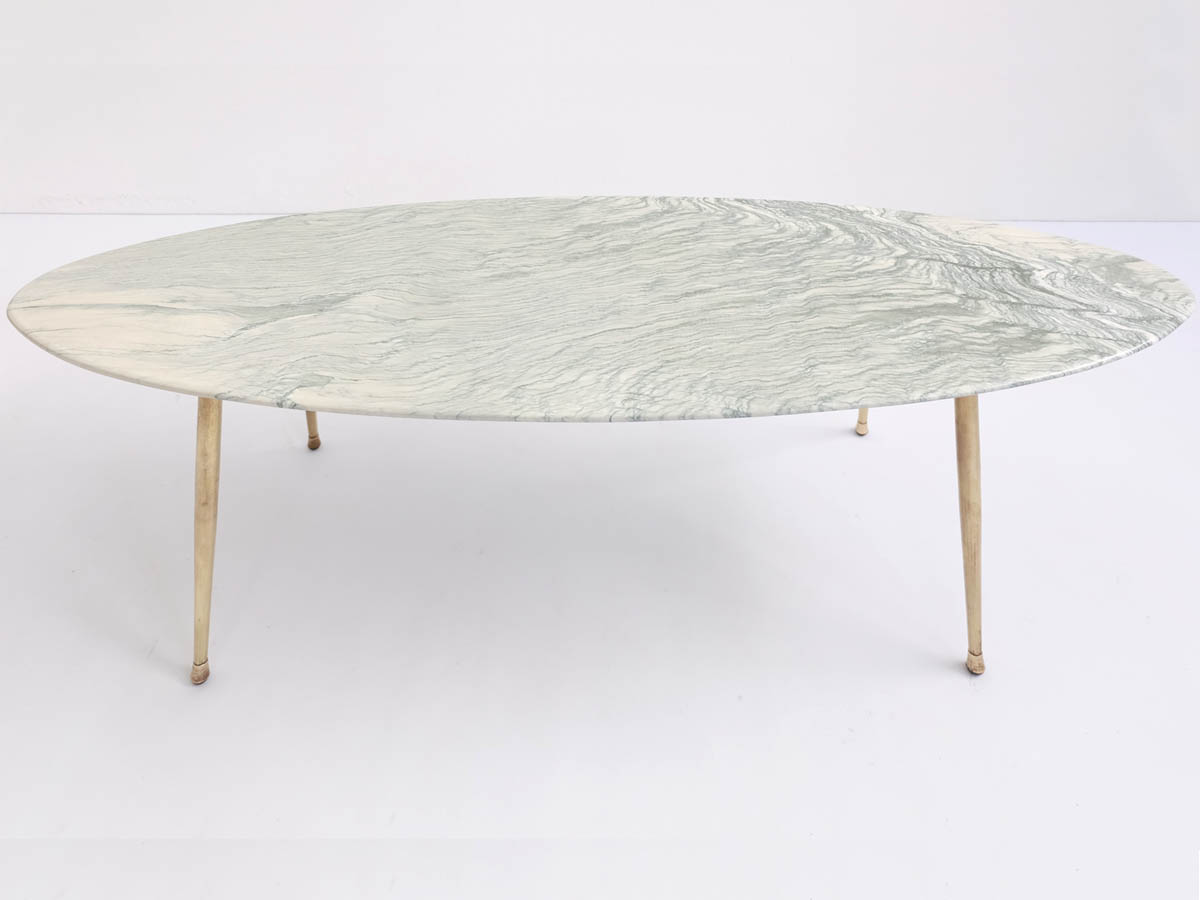 Oval coffee table with "liquid green" marble