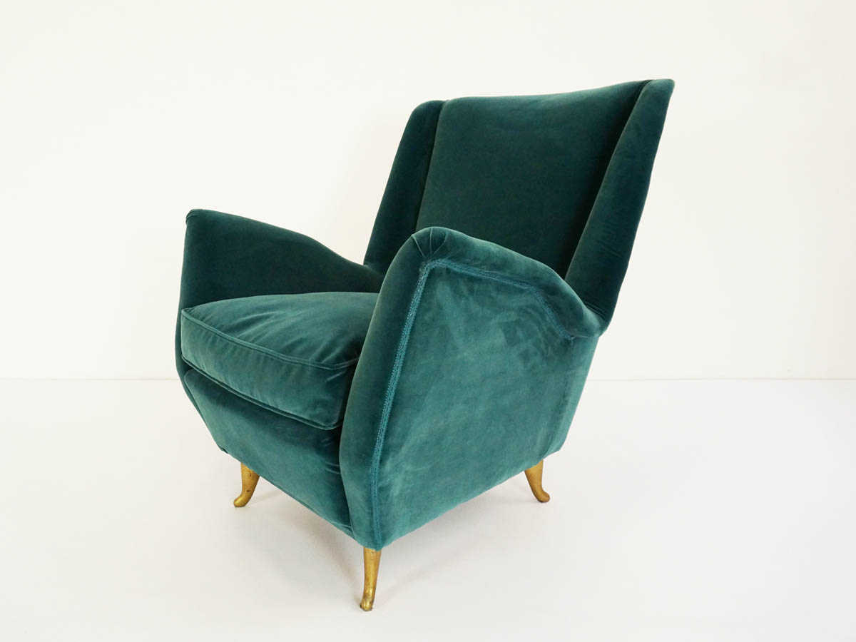 Deep green velvet cozy armchair