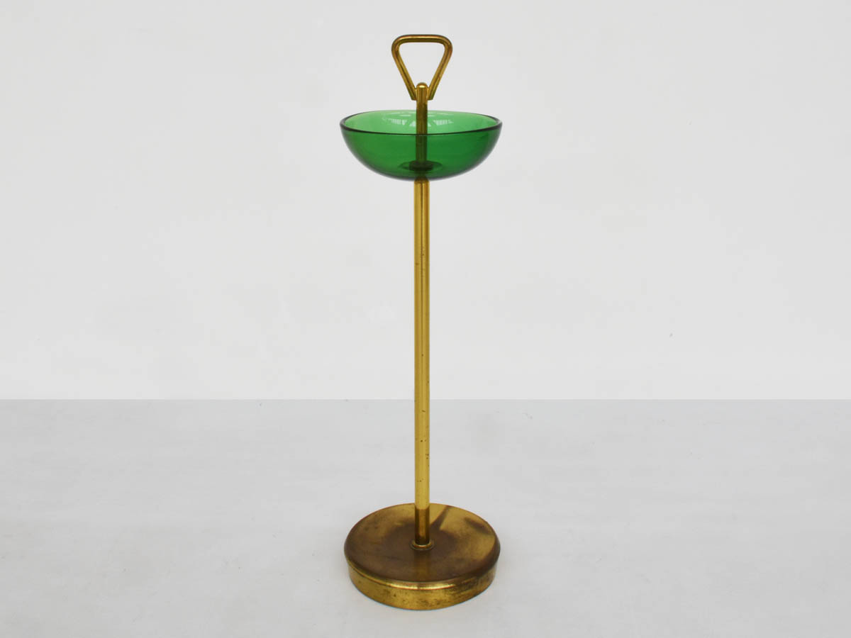 Glass and brass pocket emptier